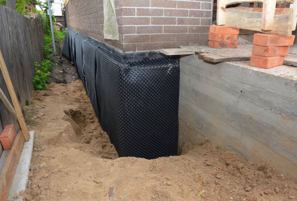 SJ Waterproofing Pros technician performing targeted Basement Waterproofing assessment in Vanleer, TN